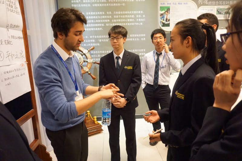 Deep Biswas explaining a concept to students during a small-group teaching session.